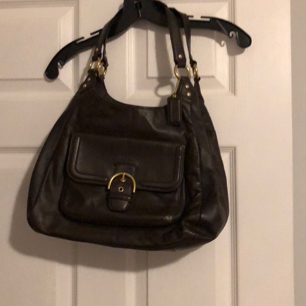 Brown coach bag with gold accents